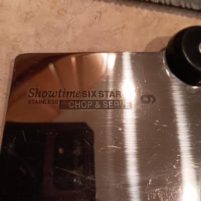 SHOWTIME SIX STAR CUTLERY AND A GLASS CUTTING BOARD