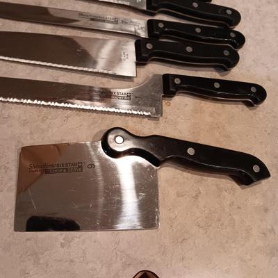 SHOWTIME SIX STAR CUTLERY AND A GLASS CUTTING BOARD
