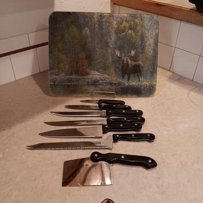 SHOWTIME SIX STAR CUTLERY AND A GLASS CUTTING BOARD
