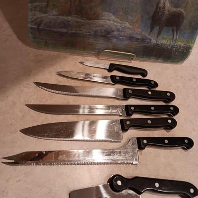 SHOWTIME SIX STAR CUTLERY AND A GLASS CUTTING BOARD