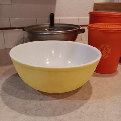 LARGE PYREX BOWL, METAL STRAINERS AND TUPPERWARE CANISTERS