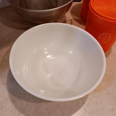 LARGE PYREX BOWL, METAL STRAINERS AND TUPPERWARE CANISTERS
