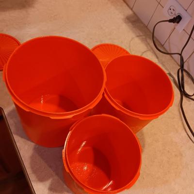 LARGE PYREX BOWL, METAL STRAINERS AND TUPPERWARE CANISTERS