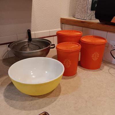 LARGE PYREX BOWL, METAL STRAINERS AND TUPPERWARE CANISTERS