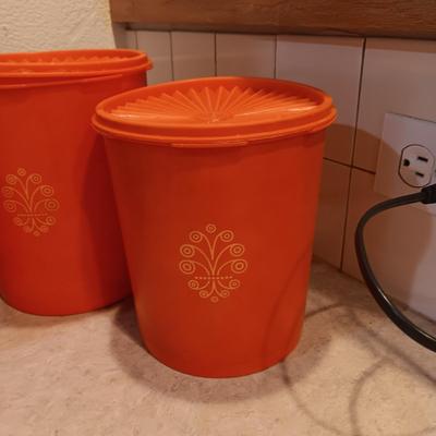 LARGE PYREX BOWL, METAL STRAINERS AND TUPPERWARE CANISTERS