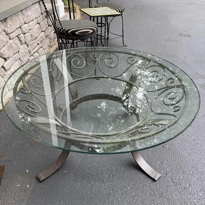 Round glass coffee table with metal stand