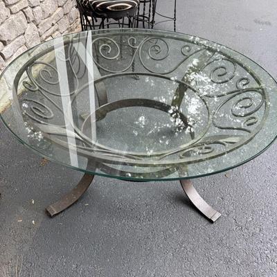 Round glass coffee table with metal stand