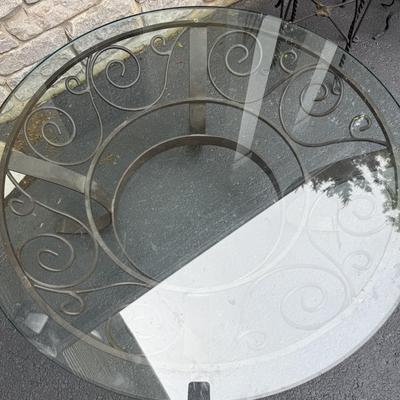 Round glass coffee table with metal stand