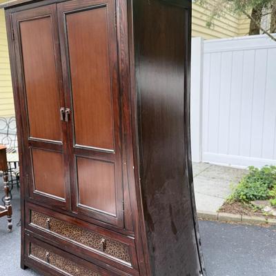 Wood armoire with floral detail