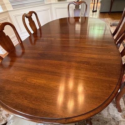Beautiful oval dining table and 8 chairs with stunning upholstery