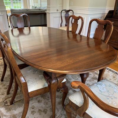 Beautiful oval dining table and 8 chairs with stunning upholstery
