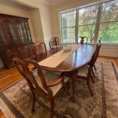 Beautiful oval dining table and 8 chairs with stunning upholstery