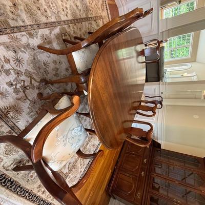Beautiful oval dining table and 8 chairs with stunning upholstery
