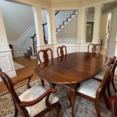 Beautiful oval dining table and 8 chairs with stunning upholstery