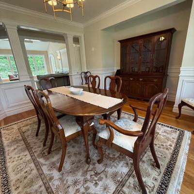 Beautiful oval dining table and 8 chairs with stunning upholstery