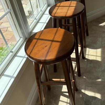 Three round counter height wood stools