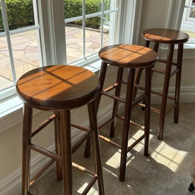 Three round counter height wood stools