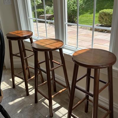 Three round counter height wood stools