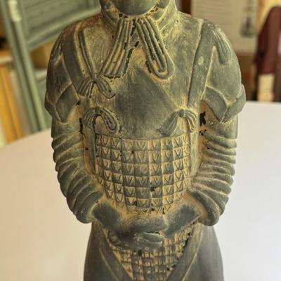 Three stone statues, foo dog, Egyptian bird and Asian soldier