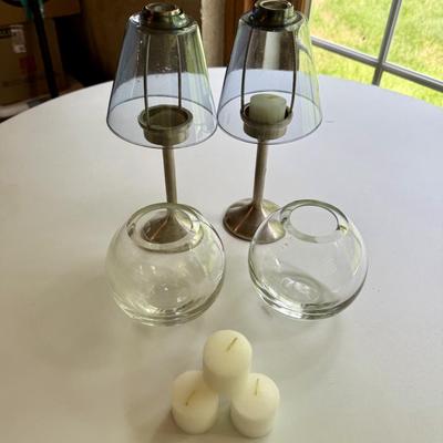 Two Pottery Barn votive holders and two glass vases