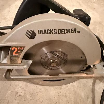 Two power hand tools, Skilsaw and Black and Decker