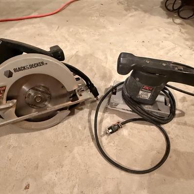 Two power hand tools, Skilsaw and Black and Decker