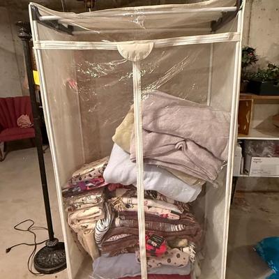 Wardrobe storage with lot of linens