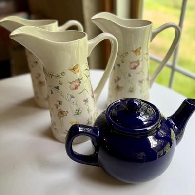 Three pretty matching pitchers and English navy teapot