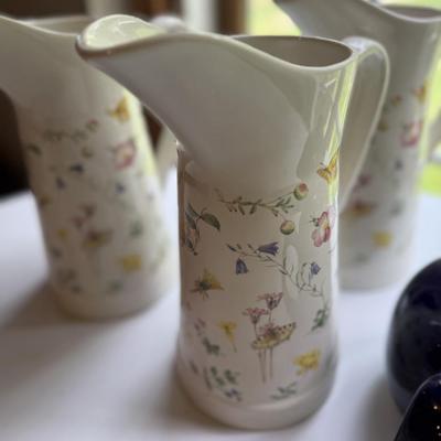 Three pretty matching pitchers and English navy teapot