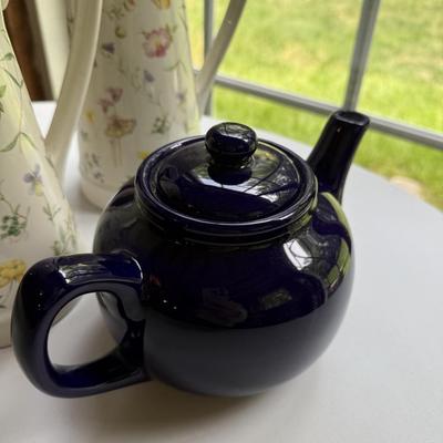Three pretty matching pitchers and English navy teapot