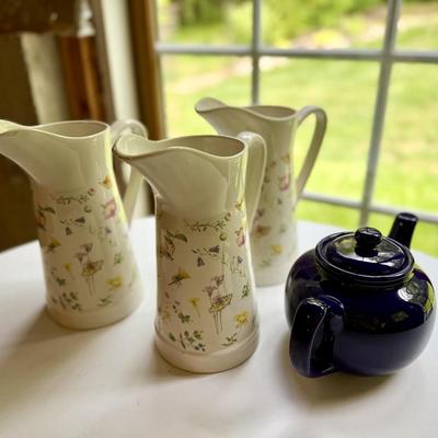 Three pretty matching pitchers and English navy teapot