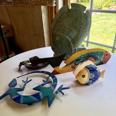 Four fish figures and cool lizard trivet
