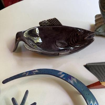 Four fish figures and cool lizard trivet