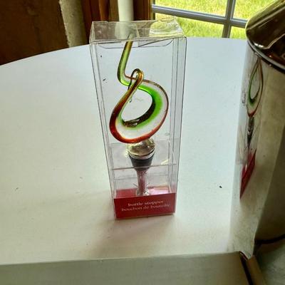 Four pieces of barware including new glass bottle stopper