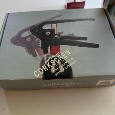 Four pieces of barware including new glass bottle stopper