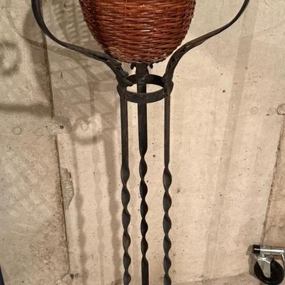 Wicker and metal plant stand