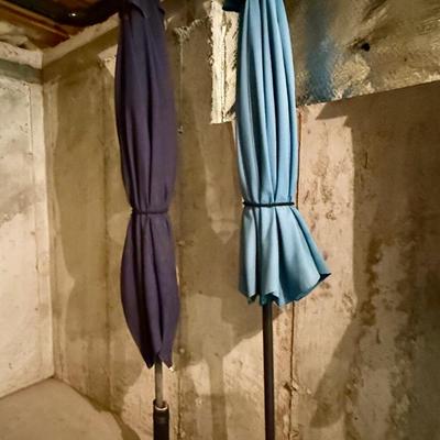 Two outdoor umbrellas, blue and purple