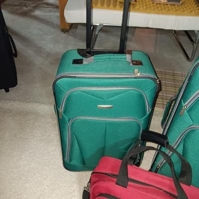 2 PIECE LUGGAGE ON 2 WHEELS EACH AND A CARRY ON BAG
