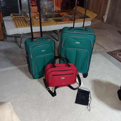 2 PIECE LUGGAGE ON 2 WHEELS EACH AND A CARRY ON BAG