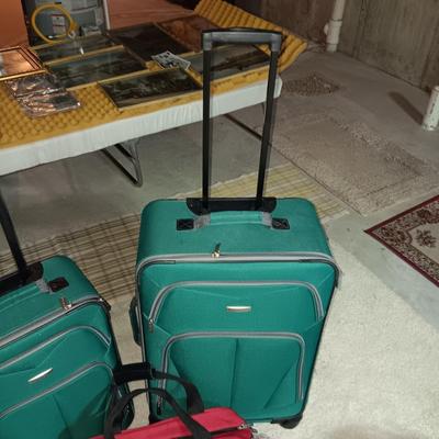 2 PIECE LUGGAGE ON 2 WHEELS EACH AND A CARRY ON BAG