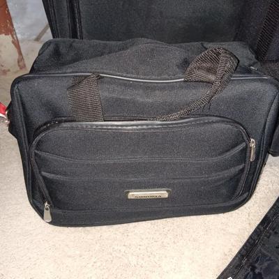 2 PIECE LUGGAGE ON 2 WHEELS EACH PLUS A CARRY ON BAG