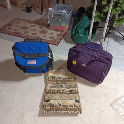 SOFT SIDED COOLER ON 2 WHEELS W/HANDLE, CARRY ON BAG ON WHEELS AND TALL BAG ON WHEELS