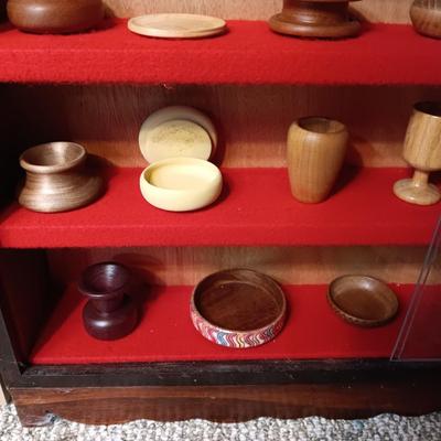 MINIATURE WOODEN VESSELS HANDMADE BY OUR CLIENT IN A HANDMADE DISPLAY CASE