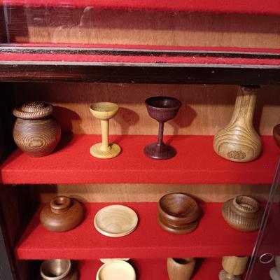 MINIATURE WOODEN VESSELS HANDMADE BY OUR CLIENT IN A HANDMADE DISPLAY CASE