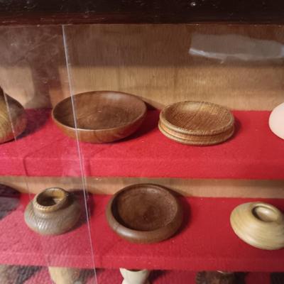 MINIATURE WOODEN VESSELS HANDMADE BY OUR CLIENT IN A HANDMADE DISPLAY CASE