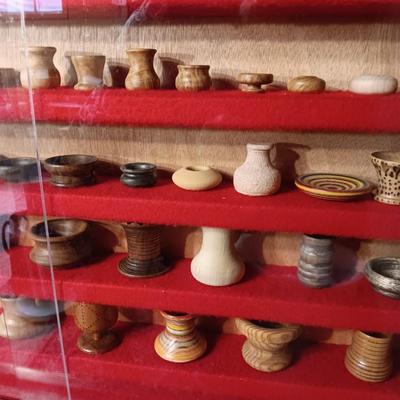 MINIATURE WOODEN VESSELS HANDMADE BY OUR CLIENT IN A HANDMADE DISPLAY CASE