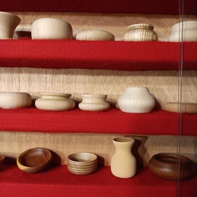 MINIATURE WOODEN VESSELS HANDMADE BY OUR CLIENT IN A HANDMADE DISPLAY CASE