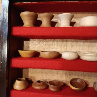 MINIATURE WOODEN VESSELS HANDMADE BY OUR CLIENT IN A HANDMADE DISPLAY CASE
