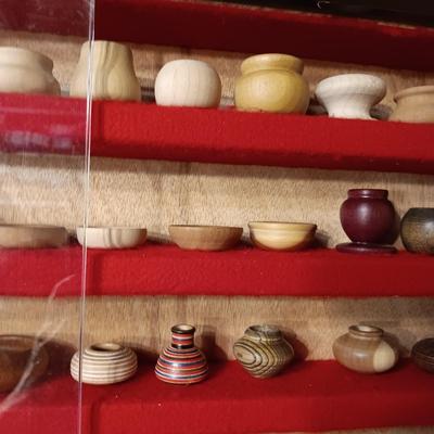 MINIATURE WOODEN VESSELS HANDMADE BY OUR CLIENT IN A HANDMADE DISPLAY CASE