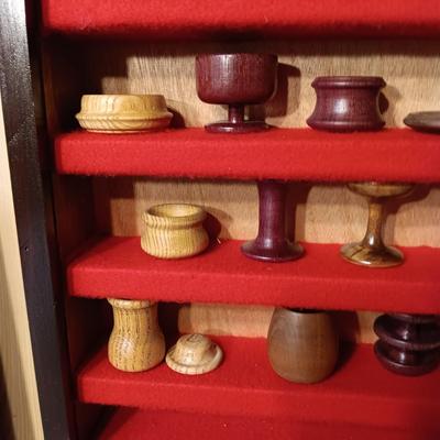 MINIATURE WOODEN VESSELS HANDMADE BY OUR CLIENT IN A HANDMADE DISPLAY CASE